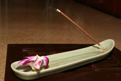 Smoke rising from a stick of incense